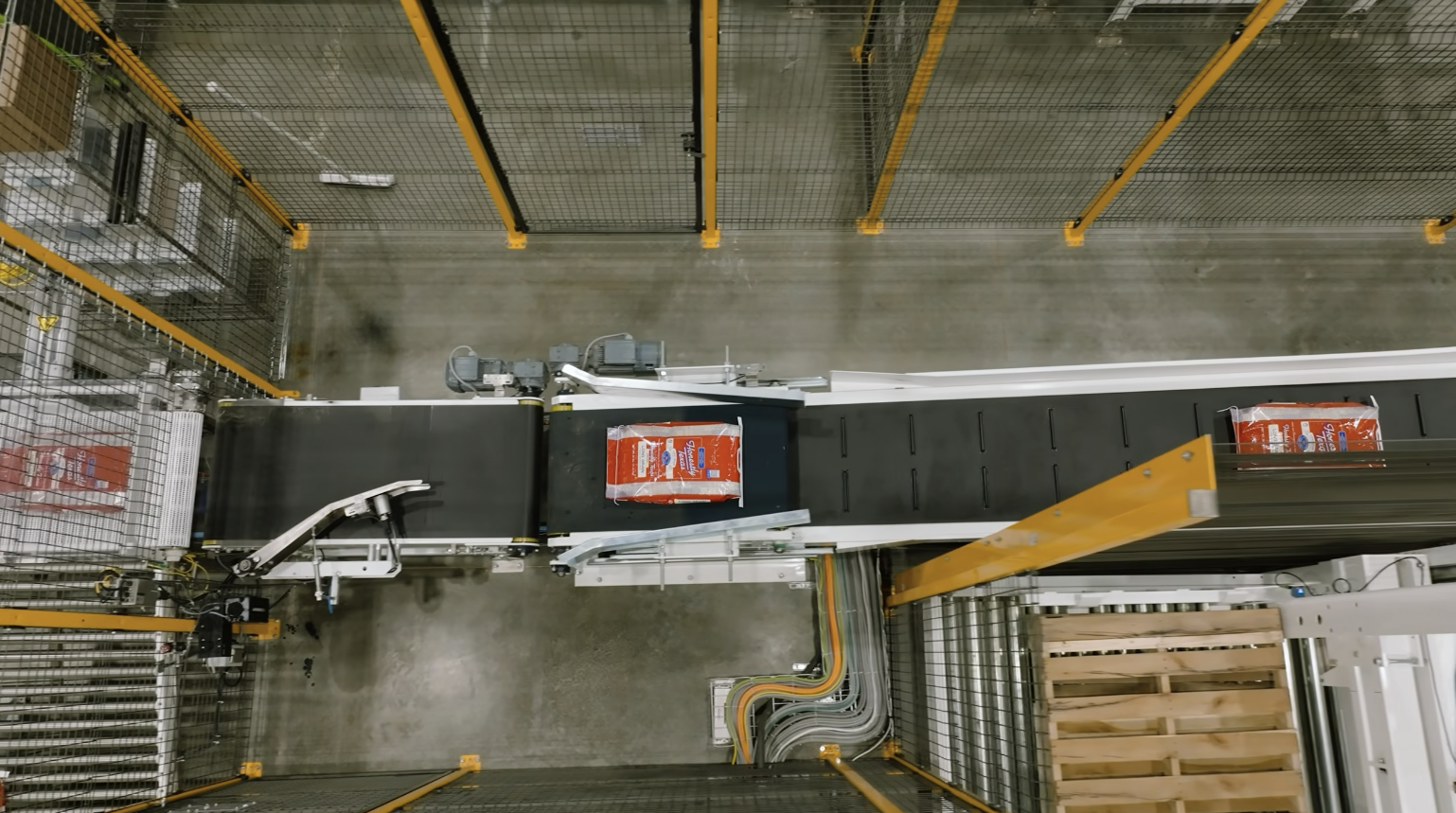 Overhead view of the bagging conveyor at Texas Rice Milling